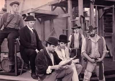 Coriolanus — Rehearsal; citizens planning a revolt. Left to right: Jacob James, Rod Carley (Director), Randy Pryce, unknown, unknown, Gideon Heath (credited as Bill Baker), Walking Shadow Theatre, Brockville Riverfest, 1997